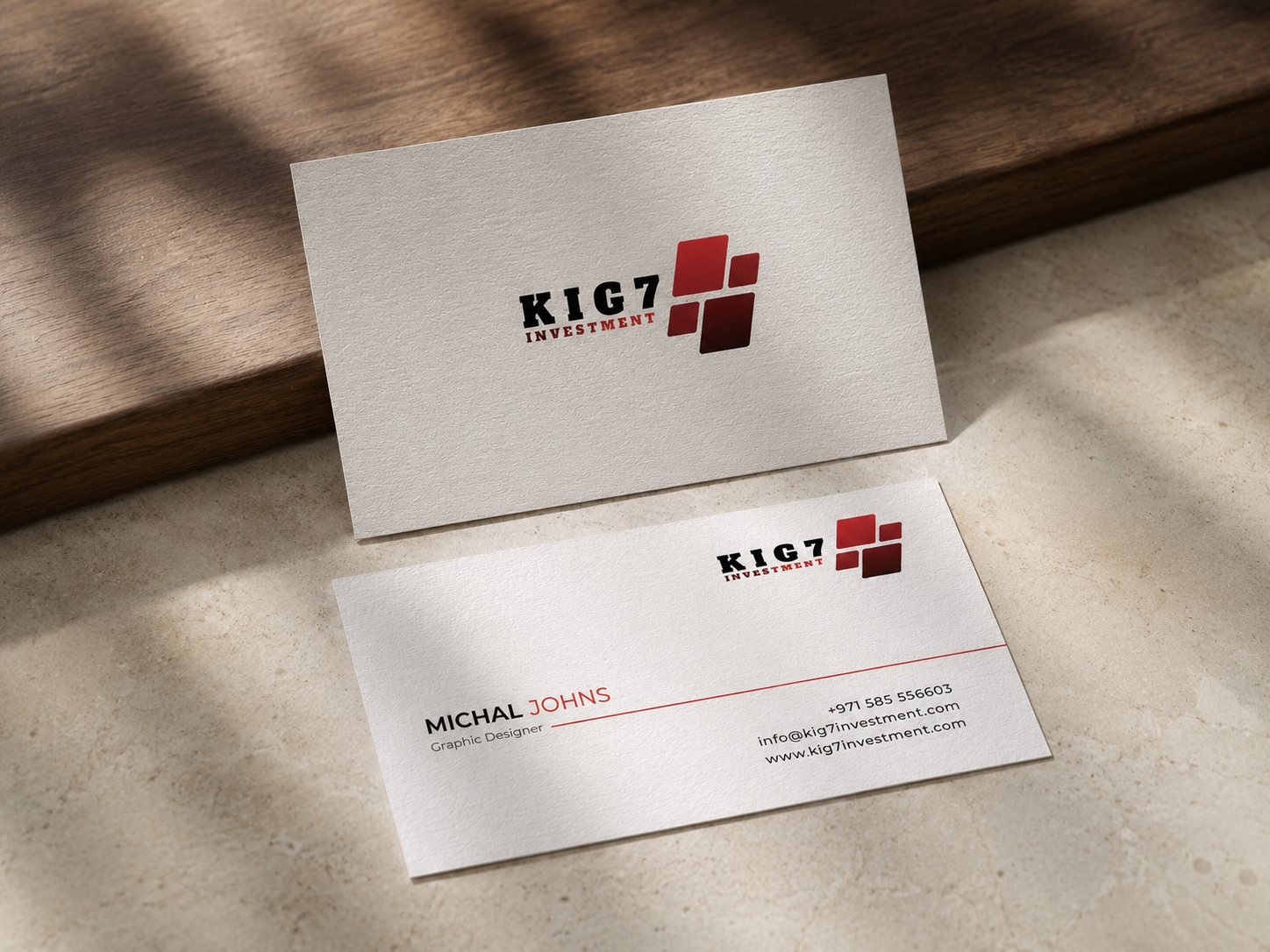 KIG7 Investment business card and envelope on a desk